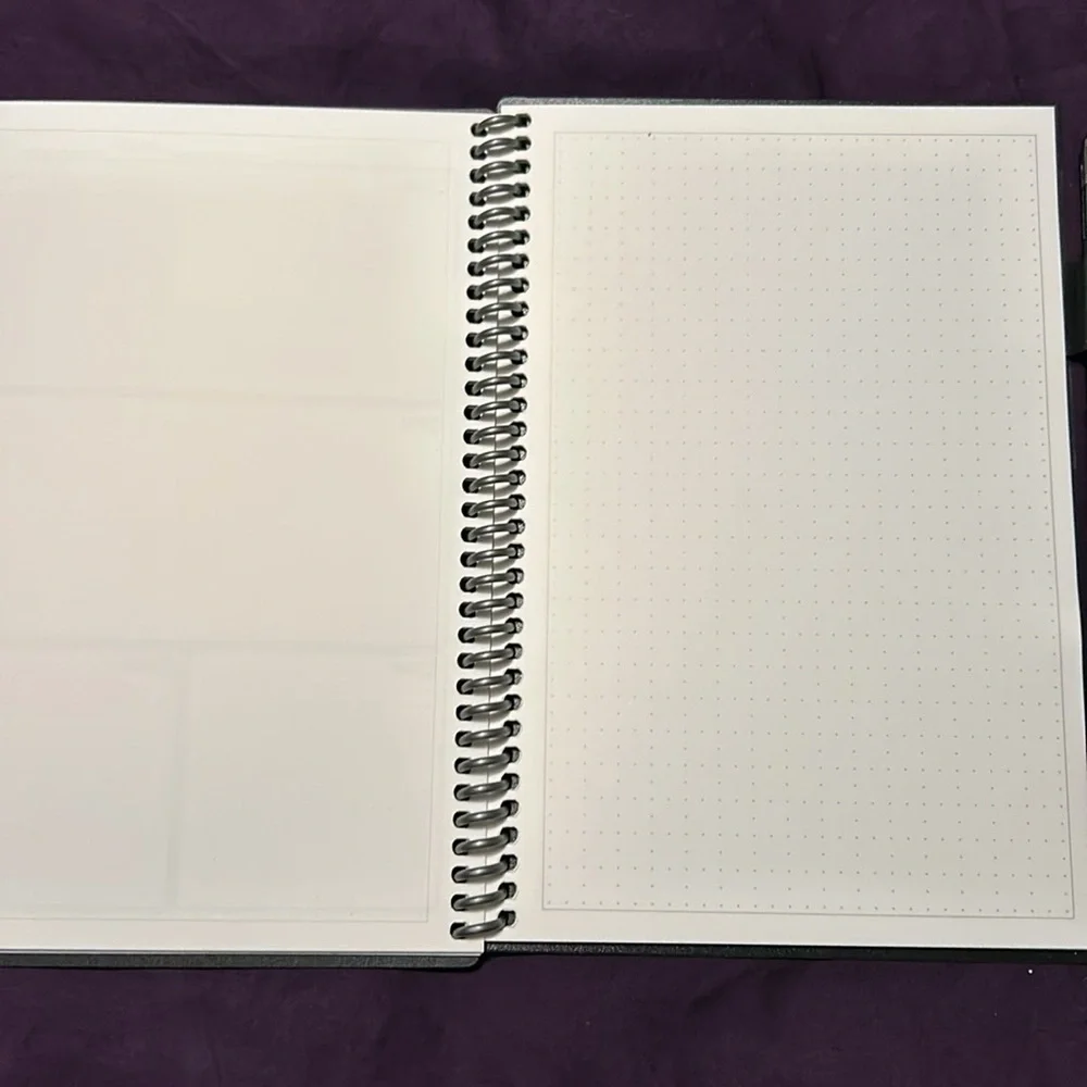 Smart book planner includes pen and cleaning cloth